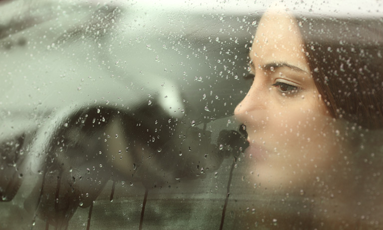woman-looking-out-car-window-768.jpg