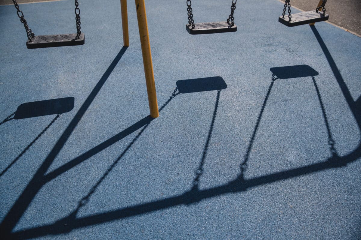 Shadows of swings on a playground