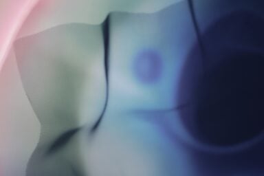 Close-up of blue and pink gauze, showcasing intricate details suggestive of psychodynamic therapy.