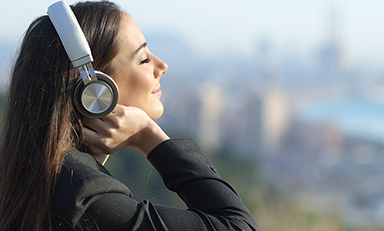 Business woman relaxing listening to music