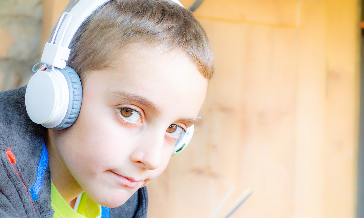 Closeup of boy wearing headphones