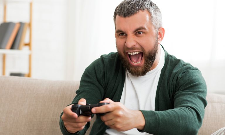 Middle-aged man playing video games