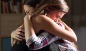 Women sharing grief, embracing